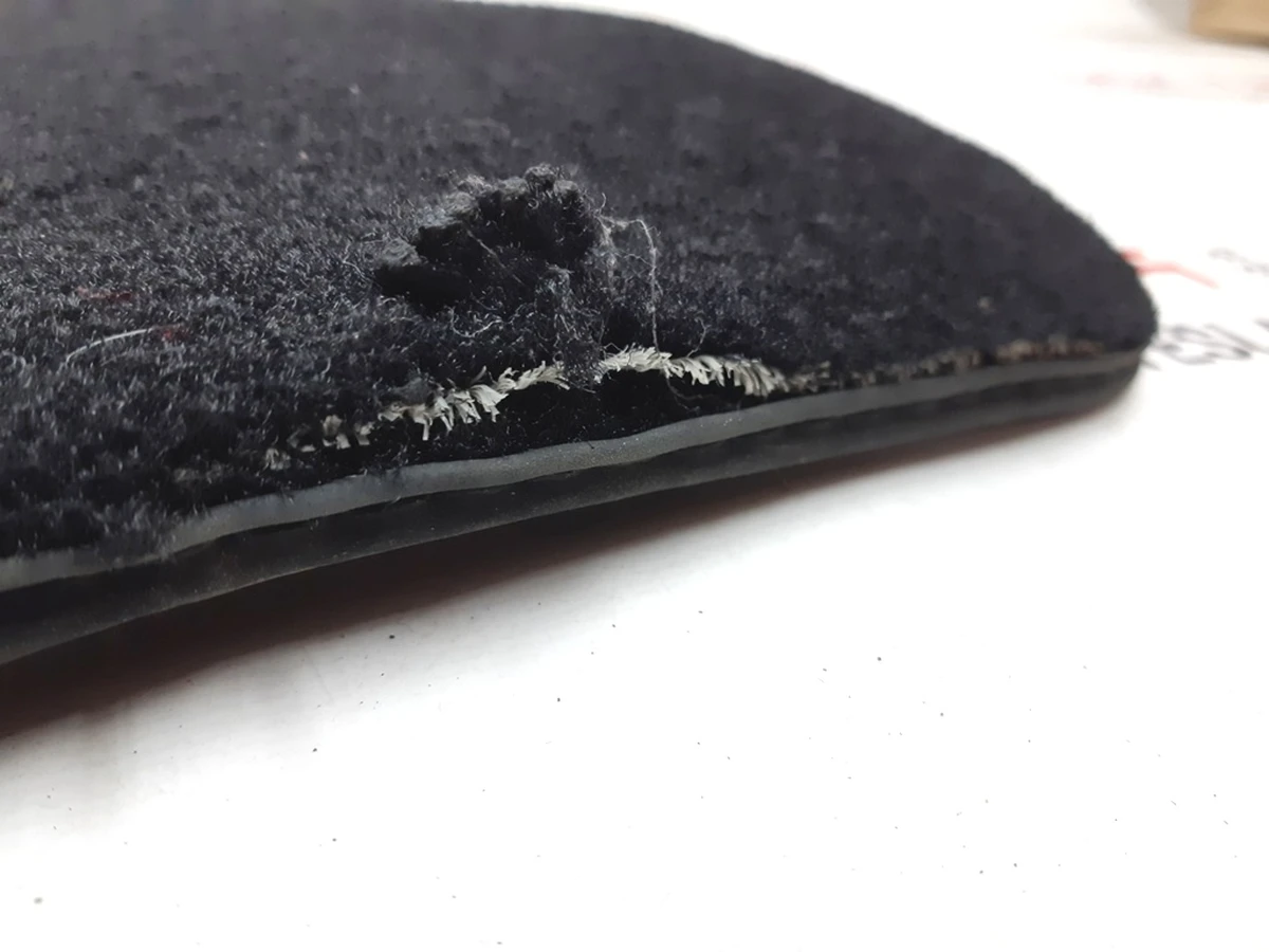 5 Carpet of the first row of passenger seats rubberized with damage Tesla model S, model S REST 1047686-00-D