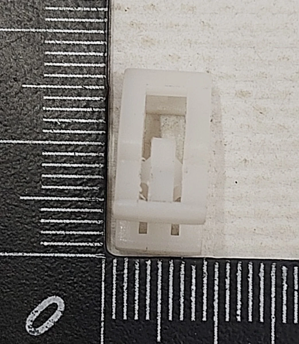 22 Кліпса пластикова накладки декоративної основи сидінь 1-го ряду Tesla Model S REST, Model X, Model 3, Model Y 1067403-00-A