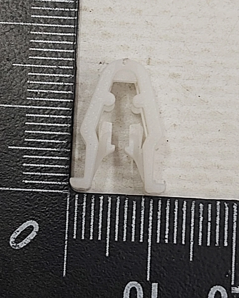 22 Кліпса пластикова накладки декоративної основи сидінь 1-го ряду Tesla Model S REST, Model X, Model 3, Model Y 1067403-00-A