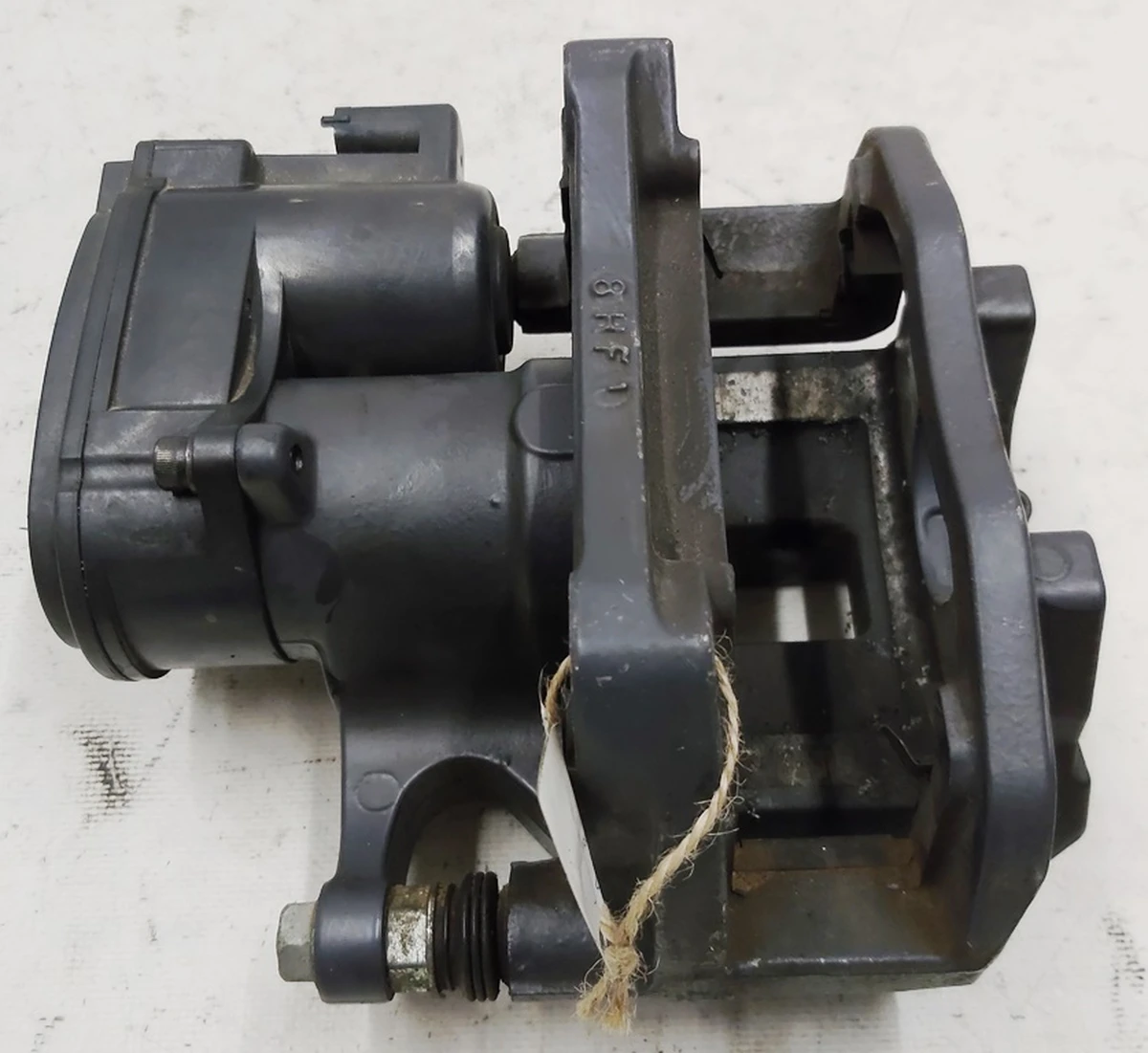 1 Суппорт тормозной задний левый MANDO (без тормозных колодок) и накладки "TESLA" Tesla model S REST, Tesla model X 1078541-00-B