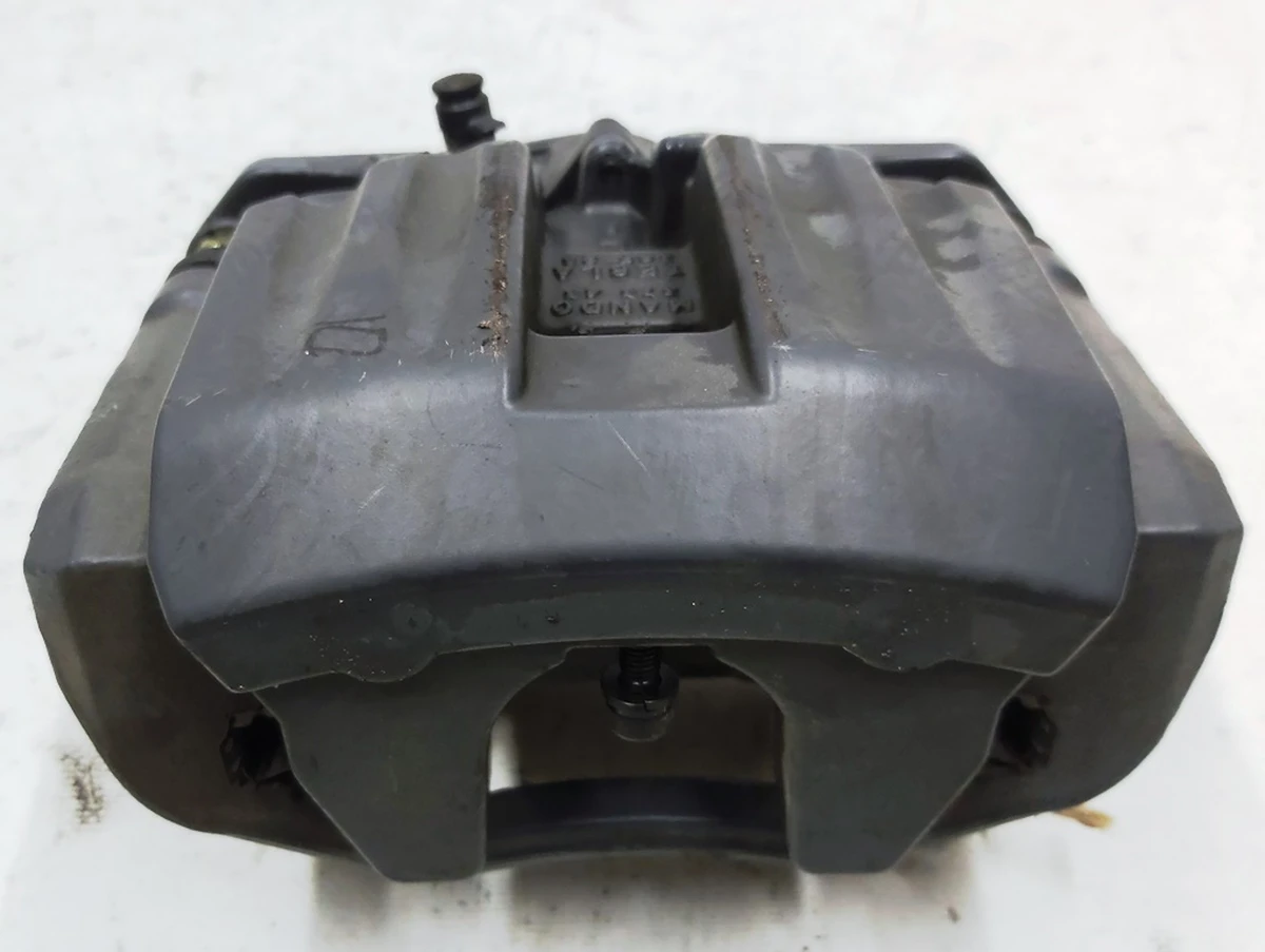 1 Суппорт тормозной задний левый MANDO (без тормозных колодок) и накладки "TESLA" Tesla model S REST, Tesla model X 1078541-00-B