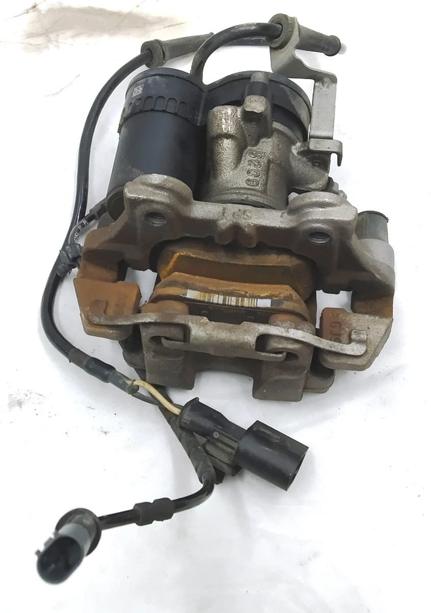 Супорт гальмівний задній правий в зборі з направляючою колодками супортом стоянкового гальма BMW i3 34216860005