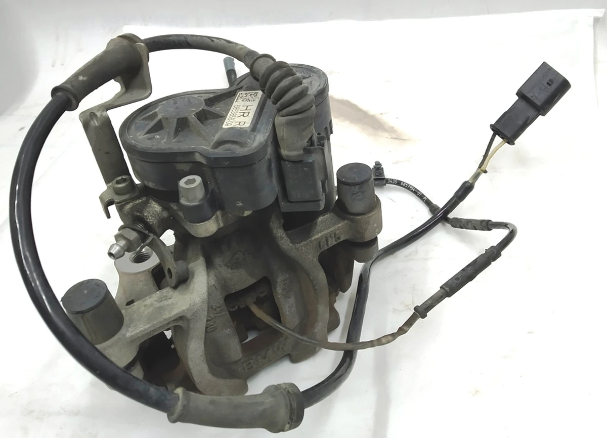 Супорт гальмівний задній правий в зборі з направляючою колодками супортом стоянкового гальма BMW i3 34216860005