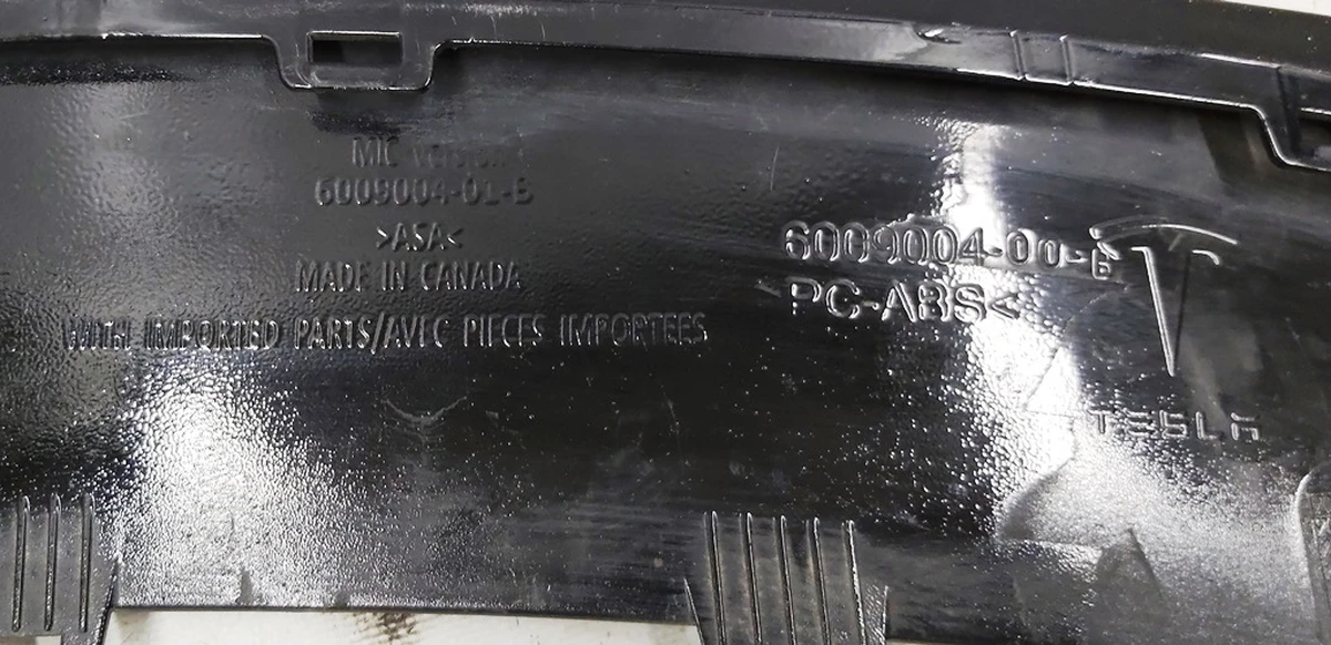 17 Декоративна накладка бампера заднього black (хром фарбована) з пошкодженням Tesla model S 6009004-00-C